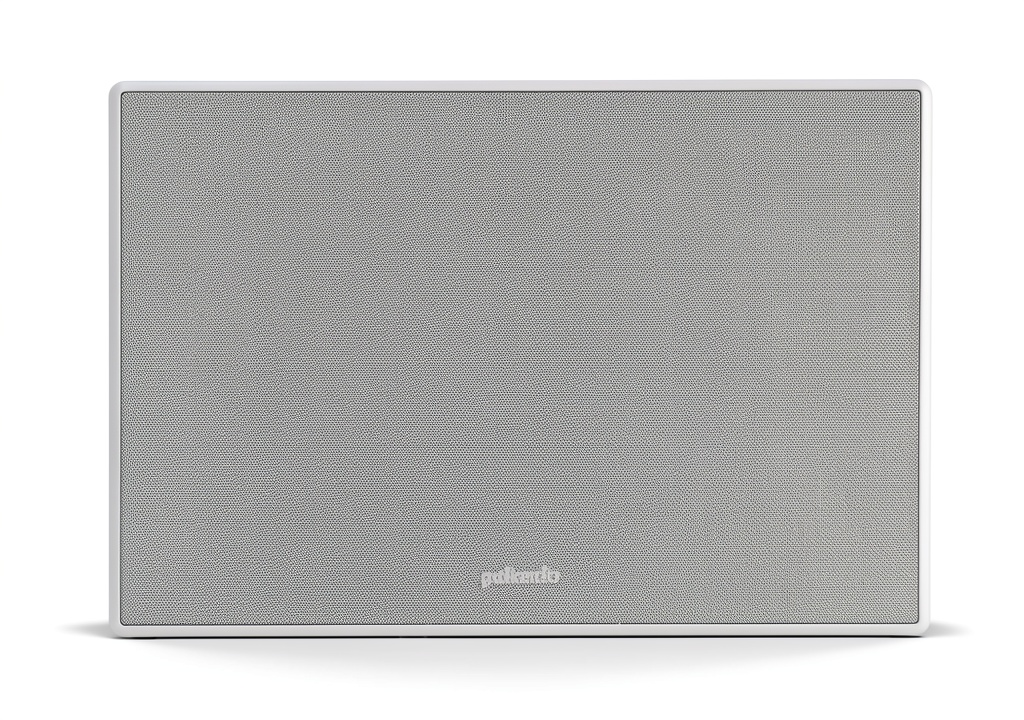 In‑wall speaker installed behind a painted wall panel